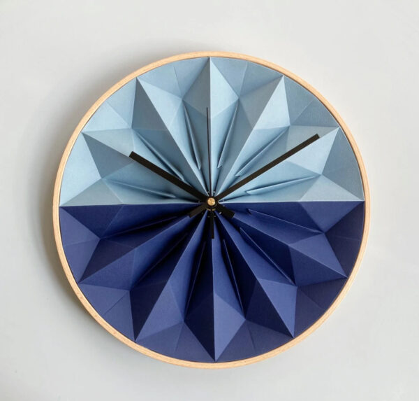 Origami clock made of folded paper and wooden edge